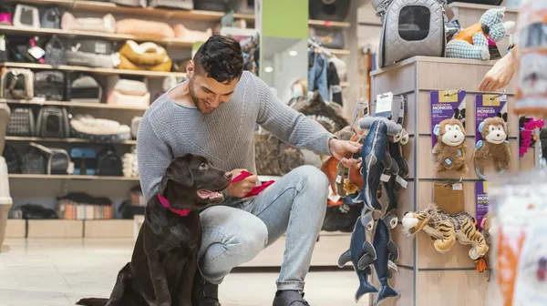 1769868755-cute-dog-with-owner-pet-shop