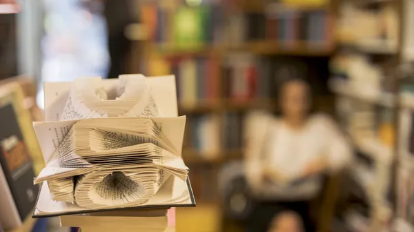 1769868641-art-book-pages-against-person-reading-library