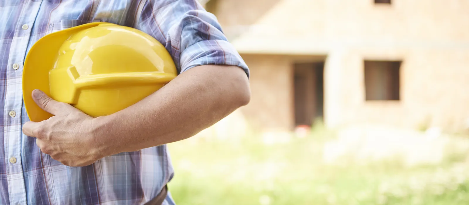 1778316897-close-up-man-holding-his-head-protector-outdoors