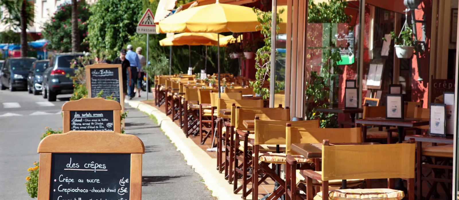 French restaurant scene with menu board